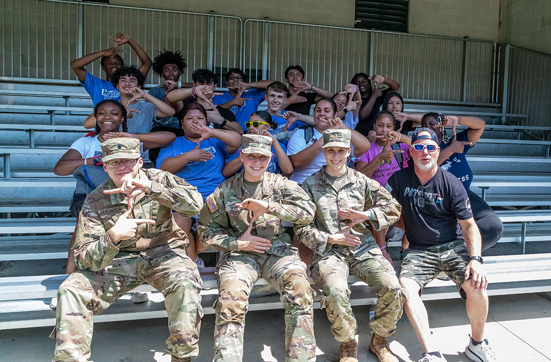 CoB Summer Leadership Academy students students with President Gary L. Miller