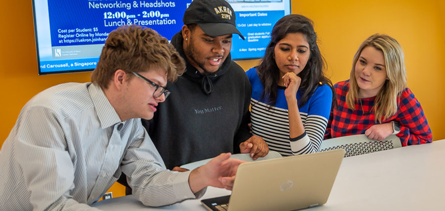 Four students working together