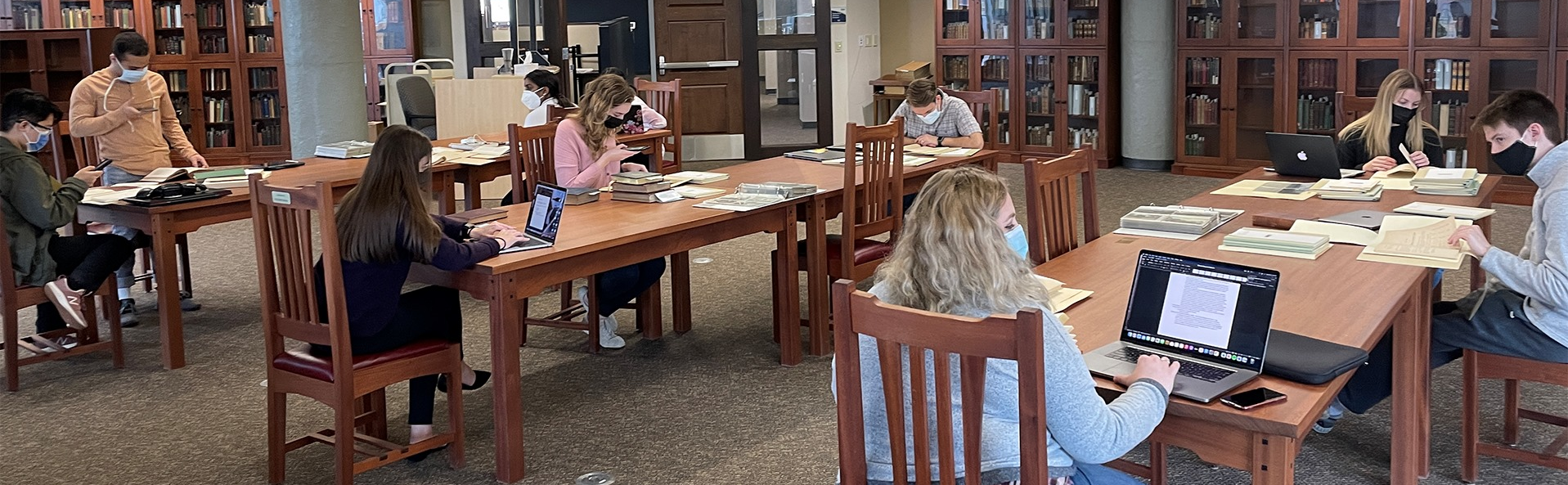 Students in an archival reading room