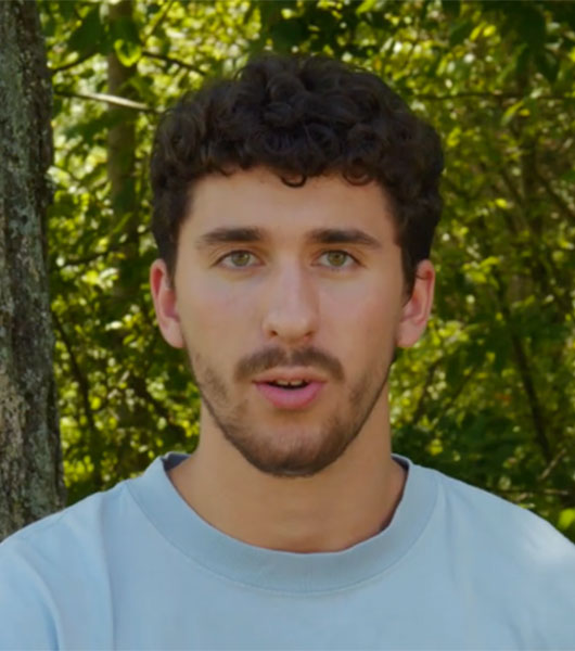 Male university of akron student talking into camera