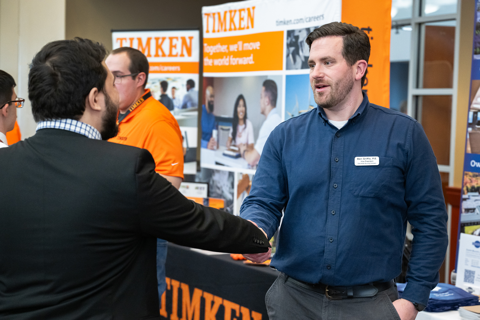 Student talking to employer at career fair