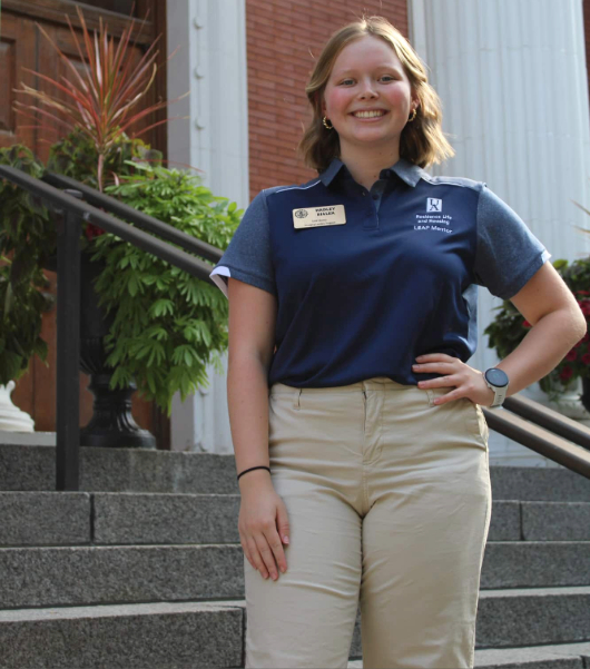 Student standing on stairs