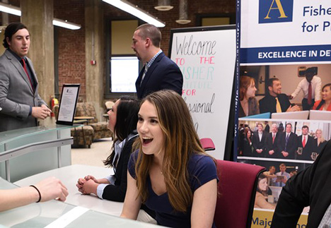 Students conversing at event