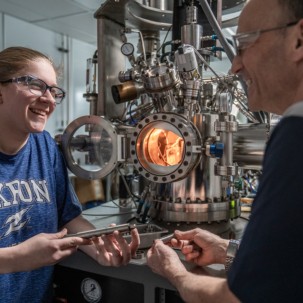 Engineering with faculty member in the lab