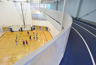 View of a indoor track and a basketball court