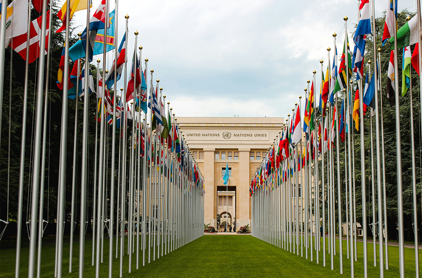 View of United Nations Building through a long row of flags
