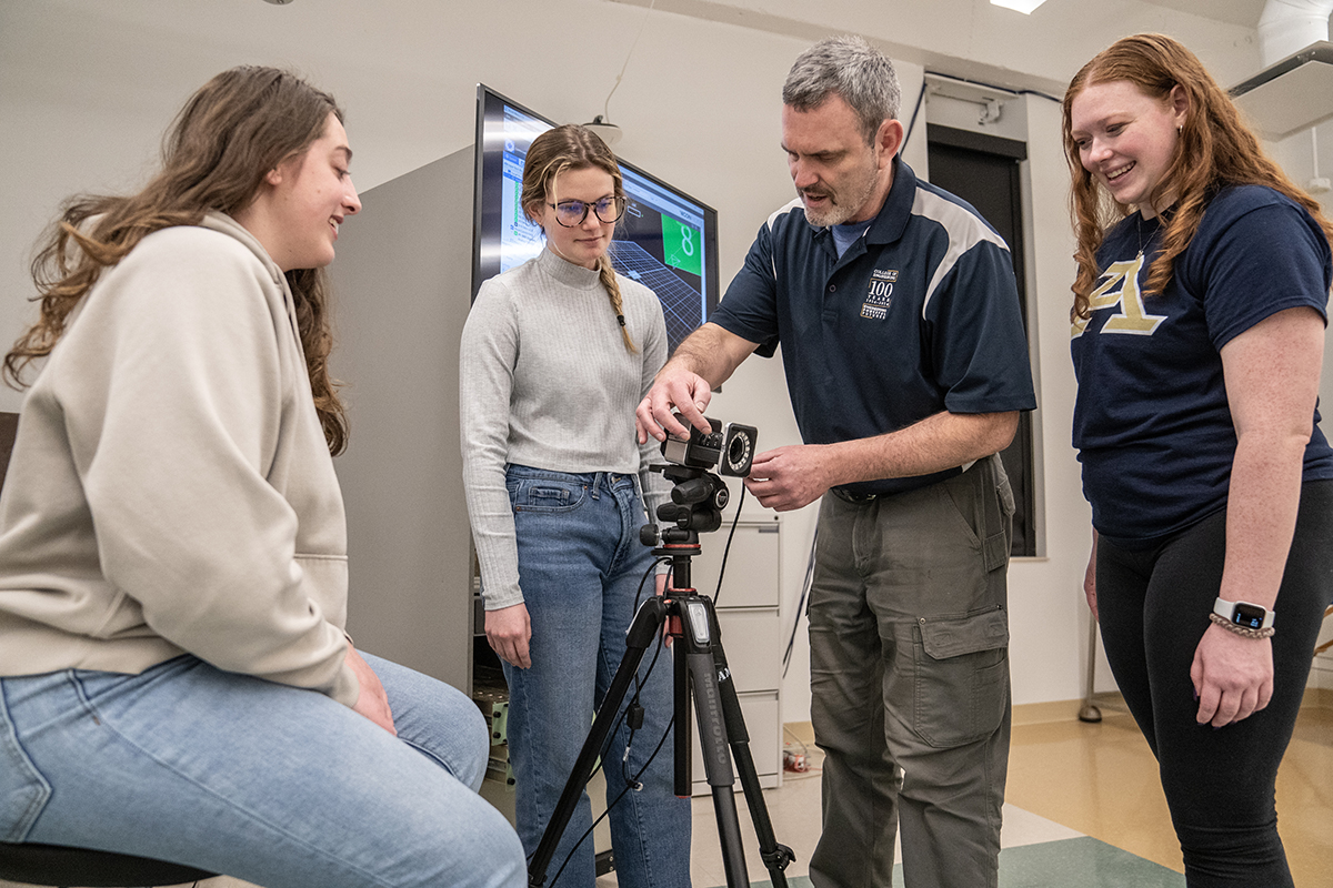 Biomedical engineering students and a staff member in the lab