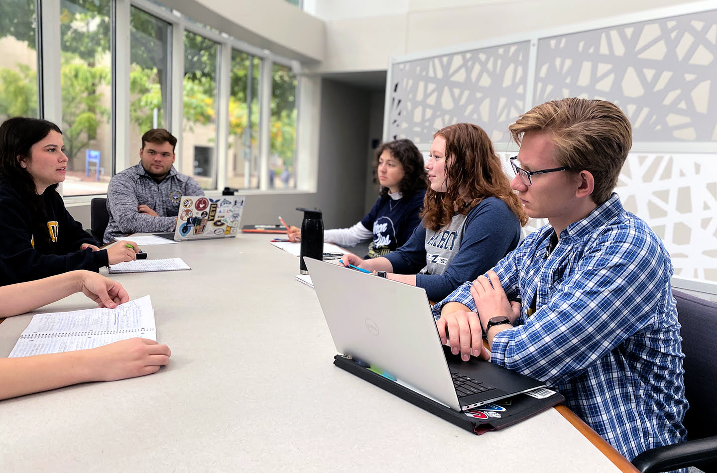 Group of students meeting in the polymer science building