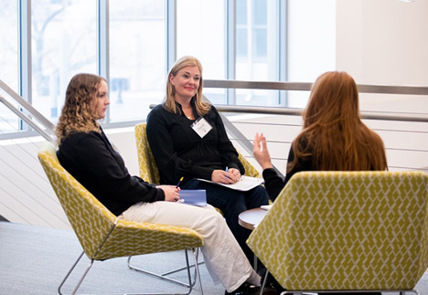 Professionals conversing around a table