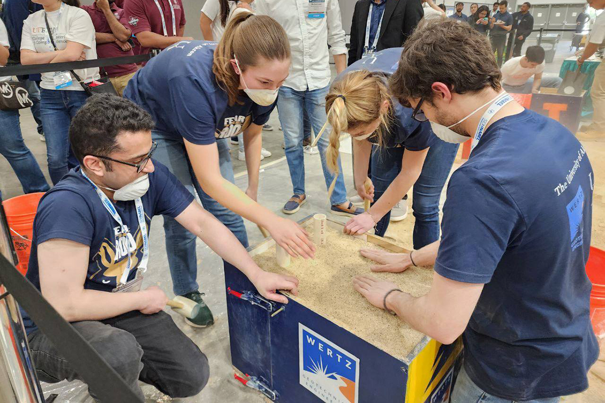 The Geo-Wall team constructing the mechanically stabilized earth retaining structure and compacting the soil. (GeoCongress 2023 – Los Angeles, CA)