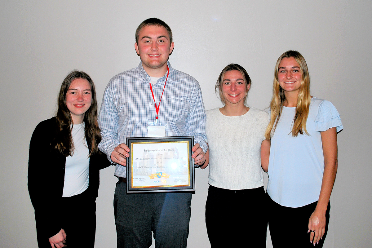 Megan McCracken, Ben Noirot, Naomi Wertz and Lauren LaRue hold their first-place award for the Construction Institute competition.