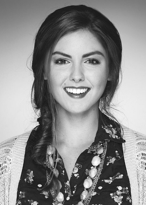 Black and white photo of woman smiling.