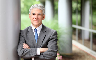 Peter Cahoon, UA alumnus, standing outside of a law building