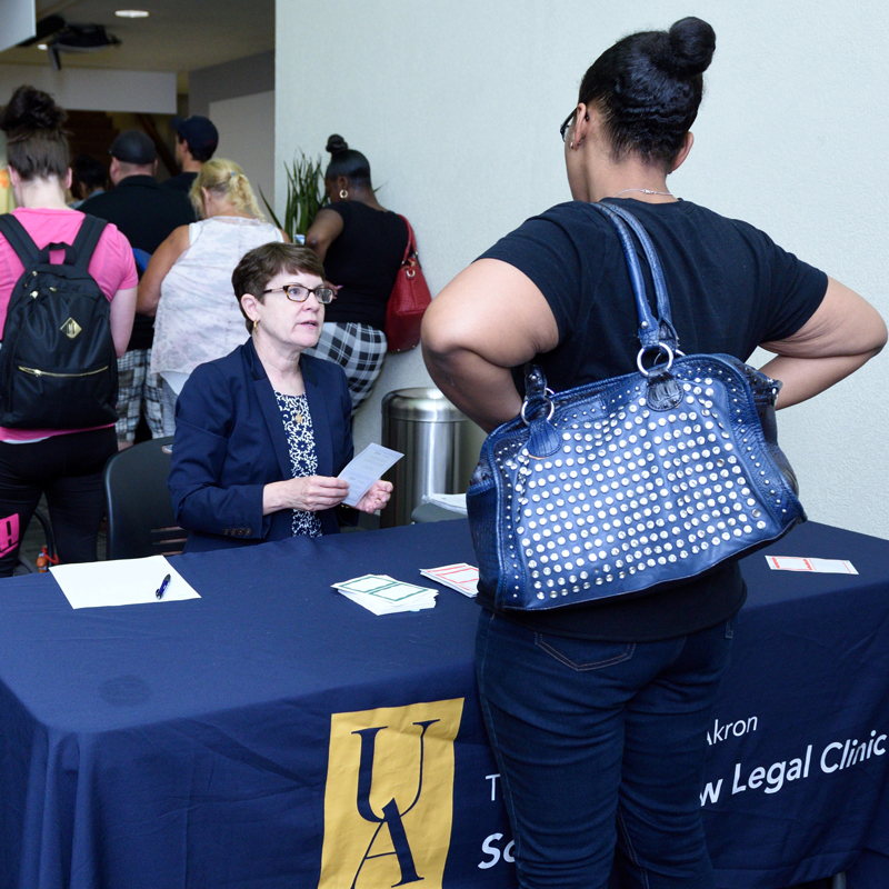 Professor Joann Sahl greets visitors at a Saturday morning Reentry Clinic